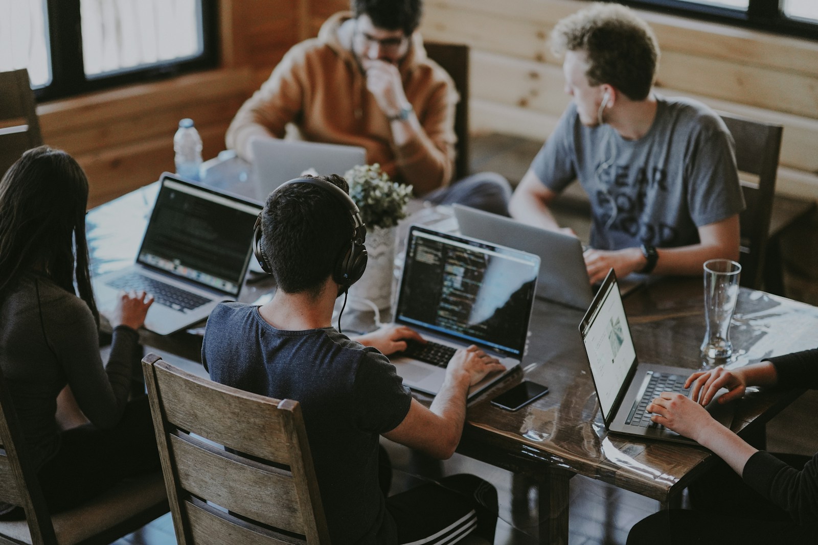 Team members collaborating together at an office table.